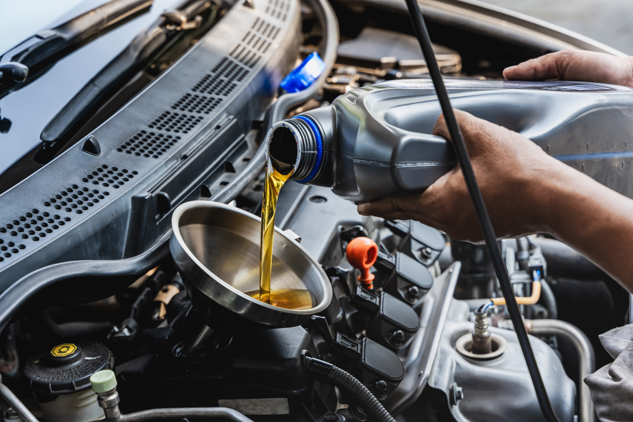 Mechanic performing an oil and filter change