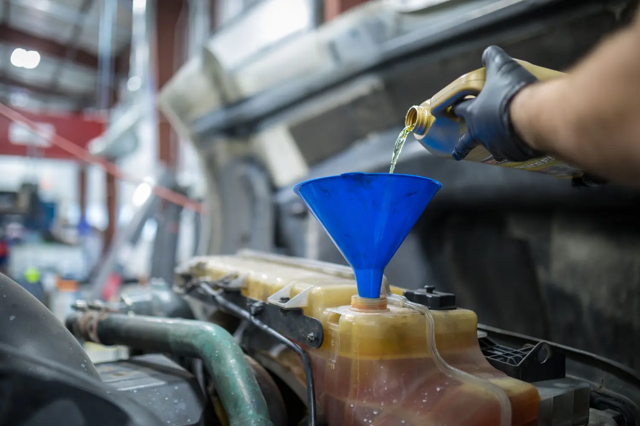 Fluid and cooling system service on a heavy-duty truck